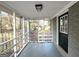 Screened porch with access to backyard at 8406 Norris Lake Rd, Snellville, GA 30039