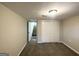 Finished basement bedroom with carpet, closet, and access to stairs at 2910 Jerome Rd, Atlanta, GA 30349
