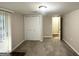 Finished basement room featuring carpet, closet, and access to hallway at 2910 Jerome Rd, Atlanta, GA 30349