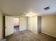 Well-lit bedroom with carpet flooring and access to hallway at 2910 Jerome Rd, Atlanta, GA 30349