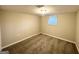 Small bedroom with neutral walls and carpet flooring at 2910 Jerome Rd, Atlanta, GA 30349