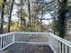 Wooden deck overlooking a wooded backyard at 2910 Jerome Rd, Atlanta, GA 30349