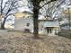 Rear view of house, showcasing deck and sloped yard at 2910 Jerome Rd, Atlanta, GA 30349