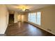Bright living room with wood-look floors, large windows and view of entryway at 2910 Jerome Rd, Atlanta, GA 30349