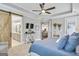 Main bedroom with barn door to bathroom and sitting area at 111 Red Maple Dr, Peachtree City, GA 30269