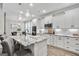 Eat-in kitchen featuring white cabinets, granite countertops and island at 111 Red Maple Dr, Peachtree City, GA 30269