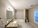 Updated bathroom with granite vanity and tile shower/tub at 1327 Sharon Nw St, Atlanta, GA 30314