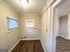 Laundry area with wood-look flooring and built-in shelving at 1327 Sharon Nw St, Atlanta, GA 30314