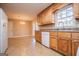 Kitchen with wood cabinets, tile floors, and access to a deck at 145 West Honeysuckle Lane, Carrollton, GA 30116