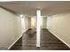 Finished basement with vinyl flooring and multiple rooms at 220 Oakcliff Nw Ct, Atlanta, GA 30331