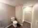 Basement bathroom with stand-up shower and toilet at 220 Oakcliff Nw Ct, Atlanta, GA 30331