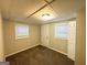 Finished basement bedroom with carpet and two windows at 220 Oakcliff Nw Ct, Atlanta, GA 30331