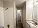Updated bathroom with shower and granite vanity at 220 Oakcliff Nw Ct, Atlanta, GA 30331