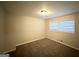 Well-lit bedroom with neutral walls and carpet at 220 Oakcliff Nw Ct, Atlanta, GA 30331