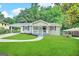 Newly renovated ranch home with a charming front porch and landscaped yard at 220 Oakcliff Nw Ct, Atlanta, GA 30331