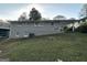 Single story house with gray siding and grassy yard at 220 Oakcliff Nw Ct, Atlanta, GA 30331