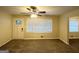 Living room with carpet, front door access and window at 220 Oakcliff Nw Ct, Atlanta, GA 30331