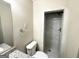 Updated bathroom with a shower and granite vanity at 3010 Pasadena Dr, Decatur, GA 30032