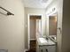 Bathroom with granite vanity and a view into another room at 3010 Pasadena Dr, Decatur, GA 30032