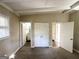 Spacious bedroom with carpet and access to bathroom and closets at 3010 Pasadena Dr, Decatur, GA 30032