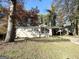 Brick ranch house with a tree-lined yard at 3010 Pasadena Dr, Decatur, GA 30032