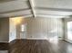 Spacious living area with wood-look floors and exposed beams at 3010 Pasadena Dr, Decatur, GA 30032
