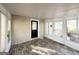 Sunroom featuring brick wall and gray flooring at 3010 Pasadena Dr, Decatur, GA 30032