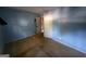 Small bedroom with blue walls and carpeting at 3149 Patuxent Trce, Lithonia, GA 30038