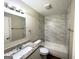Clean bathroom with granite vanity and tiled shower/tub at 4982 Millstone Walk, Stone Mountain, GA 30088