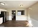 Kitchen dining area with hardwood floors and a pass-through to the living room at 4982 Millstone Walk, Stone Mountain, GA 30088