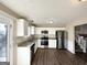 Updated kitchen, featuring stainless steel appliances and granite countertops at 4982 Millstone Walk, Stone Mountain, GA 30088