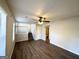 Living room with hardwood floors and access to upper level at 4982 Millstone Walk, Stone Mountain, GA 30088