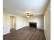 Living room with brick fireplace and hardwood floors at 4982 Millstone Walk, Stone Mountain, GA 30088