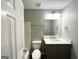 Updated bathroom with gray vanity, white countertop, and modern fixtures at 55 Stone Creek Dr, Covington, GA 30016