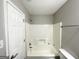Clean bathroom with tub shower combination, toilet and vanity at 55 Stone Creek Dr, Covington, GA 30016