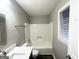 Updated bathroom with tub, shower, toilet and vanity at 55 Stone Creek Dr, Covington, GA 30016