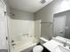 Updated bathroom with tub, shower, toilet and vanity at 55 Stone Creek Dr, Covington, GA 30016