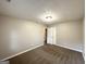Well lit bedroom with closet and access to hallway at 55 Stone Creek Dr, Covington, GA 30016