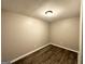 Simple bedroom with wood-look floors and neutral wall colors at 55 Stone Creek Dr, Covington, GA 30016