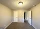 Well lit bedroom with closet and access to hallway at 55 Stone Creek Dr, Covington, GA 30016