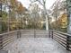 Wooden deck overlooking a wooded backyard at 55 Stone Creek Dr, Covington, GA 30016