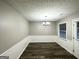 Bright dining room with hardwood floors and a chandelier at 55 Stone Creek Dr, Covington, GA 30016