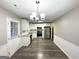 Open concept dining room with hardwood floors and kitchen view at 55 Stone Creek Dr, Covington, GA 30016