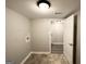 Basement laundry room with washer/dryer hookups and extra storage at 55 Stone Creek Dr, Covington, GA 30016