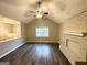 Spacious living room with hardwood floors, fireplace, and vaulted ceiling at 55 Stone Creek Dr, Covington, GA 30016
