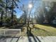 Sunny backyard with large grassy area and trees at 2057 Sombrero Se Way, Atlanta, GA 30316