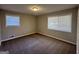 Well-lit bedroom with neutral walls, carpet flooring, and two windows at 2057 Sombrero Se Way, Atlanta, GA 30316