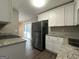 Updated kitchen featuring white shaker cabinets and stainless steel appliances at 2057 Sombrero Se Way, Atlanta, GA 30316