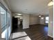 Open concept living area with dark hardwood floors and a view of the kitchen at 2057 Sombrero Se Way, Atlanta, GA 30316