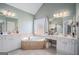 Bathroom boasts double vanities, a corner soaking tub, and a separate shower at 1390 Turtle Dove Ln, Lawrenceville, GA 30043